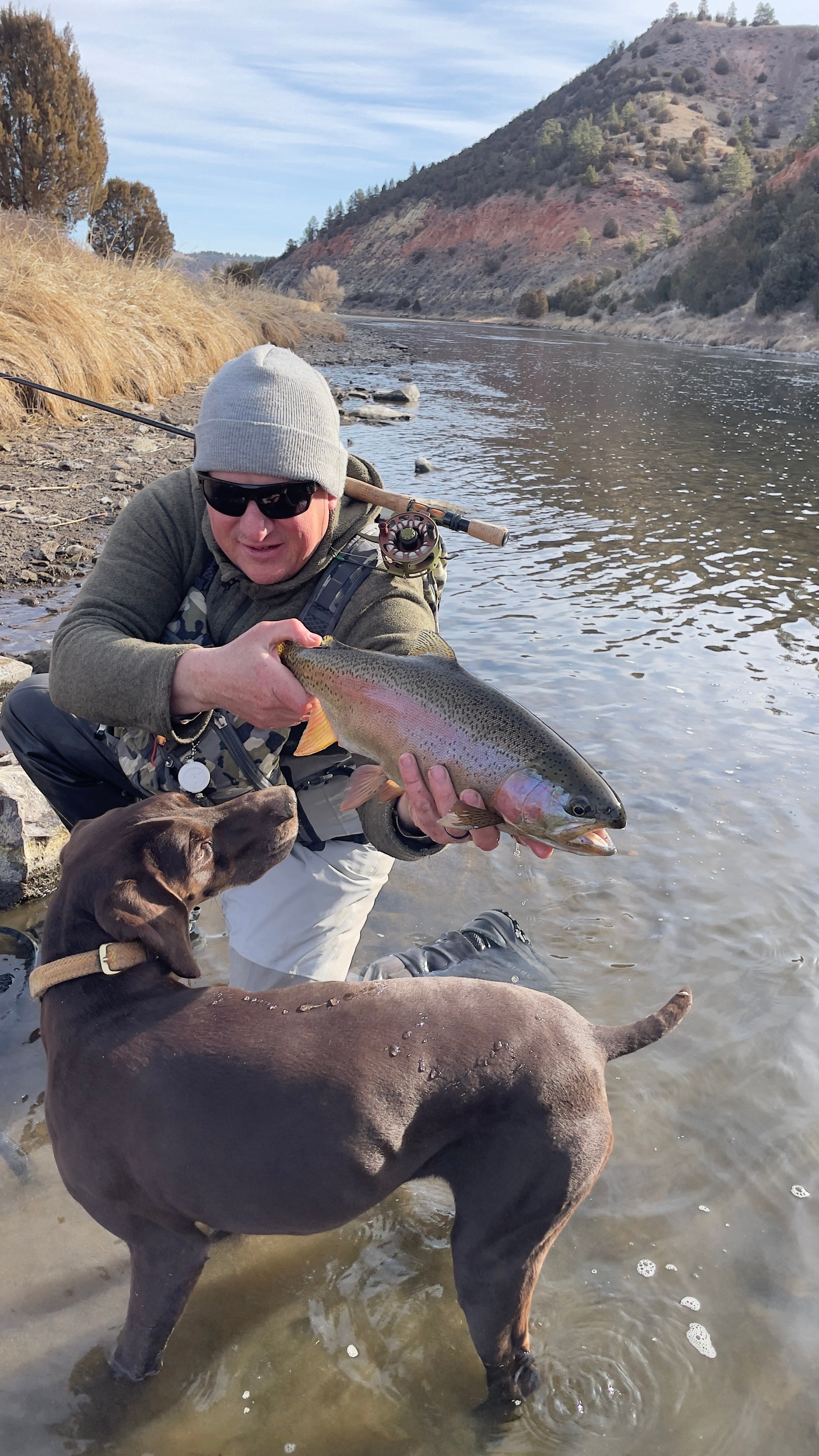 The OCR life is all about you innovation, fly-fishing, and fun! Kirk Lewis shows off a trophy catch as Hefe admires the catch.